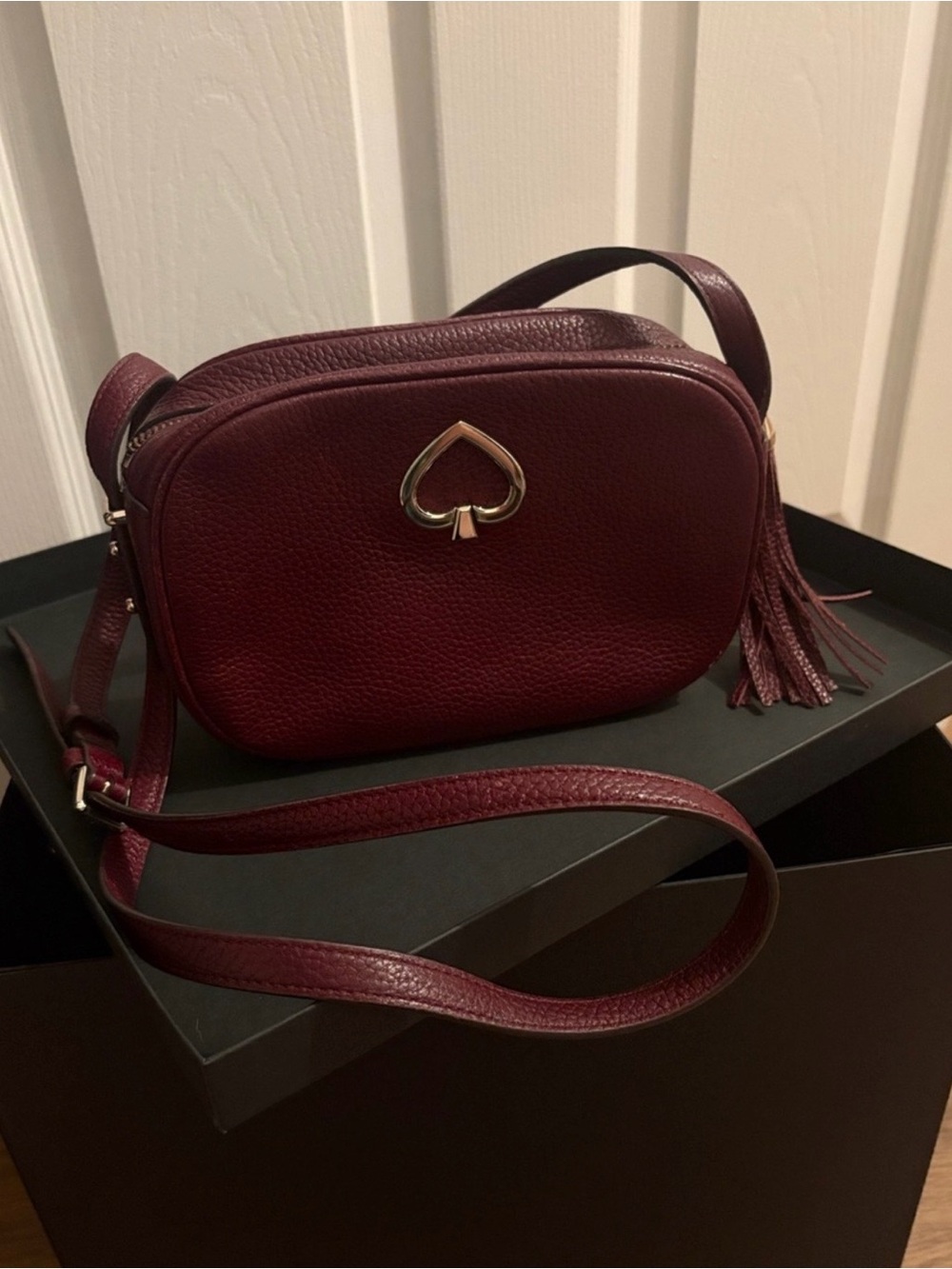 kate spade Maroon Leather Crossbody with Spade accent.